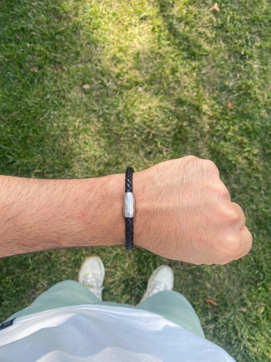 Vertig Magnetic Leather Bracelet Black (Slim) on a man&#39;s wrist. Accentuates modern style with its understated elegance and secure magnetic clasp.