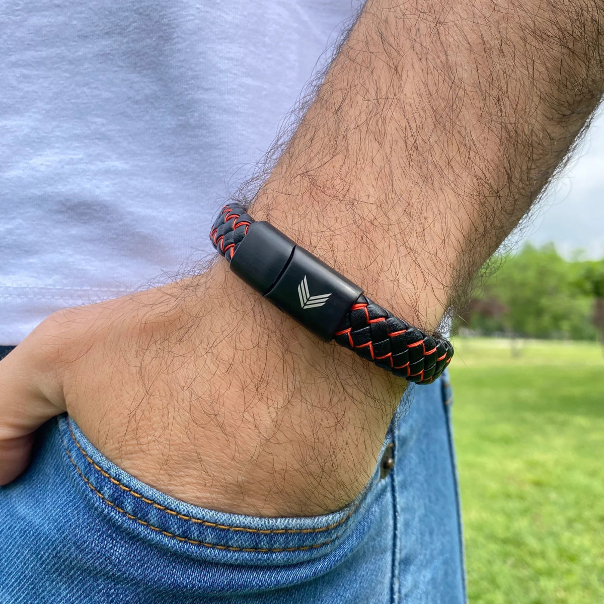 Vertig Magnetic Wide Leather Bracelet Black-Red on a man. An essential accessory for dynamic fashion, adding a touch of bold color.