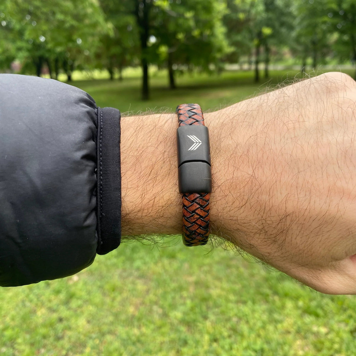 Vertig Magnetic Wide Leather Bracelet Brown on a man&#39;s forearm. Showcases the premium texture of genuine brown leather and comfortable fit.