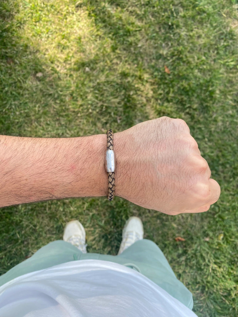 Vertig Magnetic Leather Bracelet Vintage White (Slim) on a man&#39;s wrist. Accentuates refined style with its unique hue and sleek magnetic clasp.